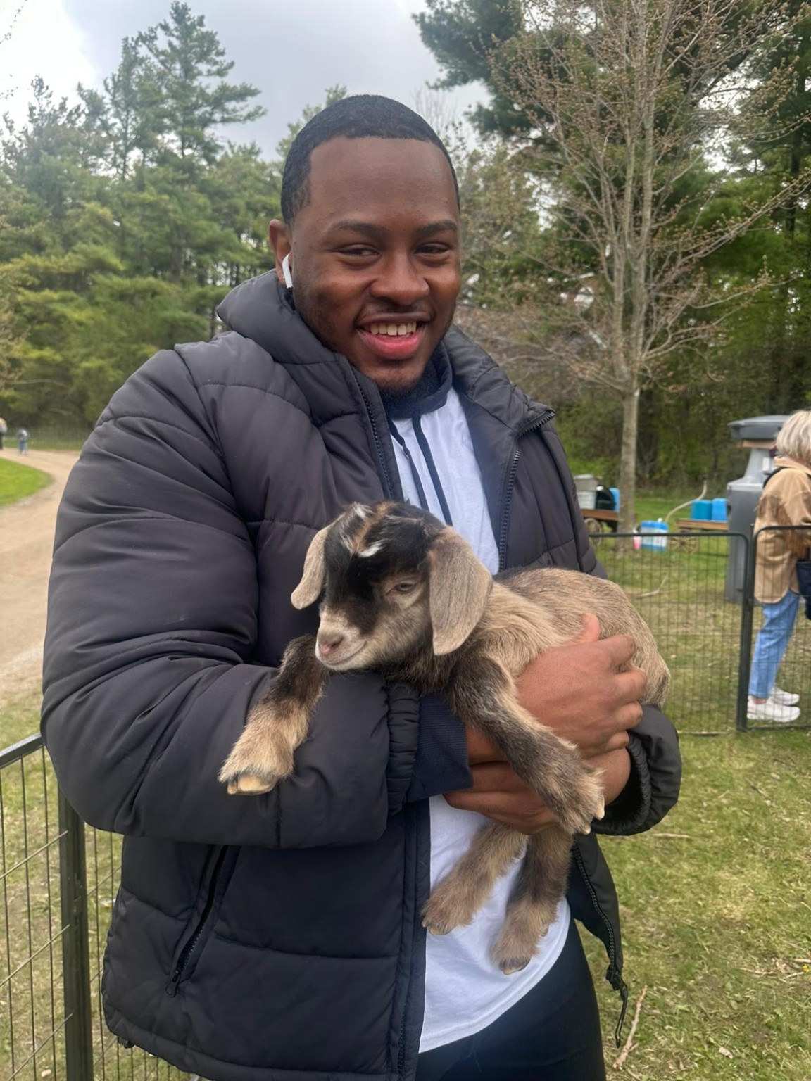 Sharing a special moment with one of our baby goats.